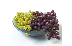 Bunches of grapes in a glass bowl