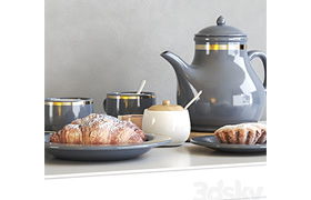 Tea set with croissant and muffin
