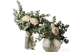 Two bouquets of roses and eucalyptus branches in glass mottl