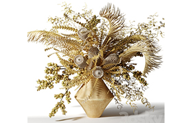 Bouquet of dried flowers with palm leaves, bankxia and walnu