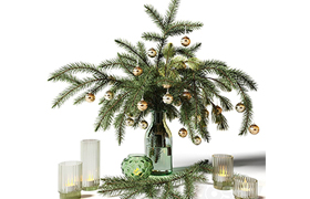 New Years bouquet of fir branches in a glass vase