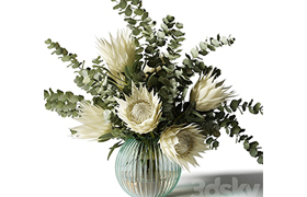 Bouquet with white proteas and eucalyptus in a ribbed glass